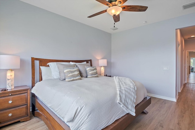 7325 Skybird Rd Unit 399, Bradenton, FL 34209 - bedroom with light wood-style floors, baseboards, and a ceiling fan