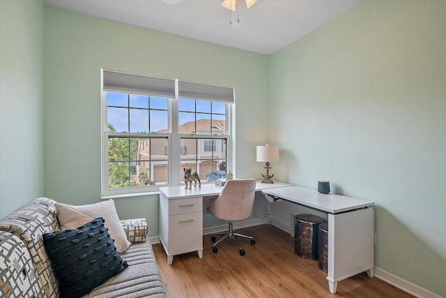 7325 Skybird Rd Unit 399, Bradenton, FL 34209 - home office with light wood-style floors, ceiling fan, and baseboards