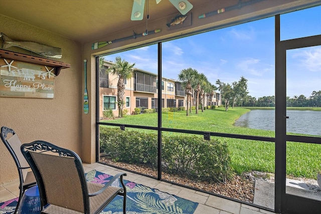7325 Skybird Rd Unit 399, Bradenton, FL 34209 - sunroom / solarium featuring a water view and ceiling fan