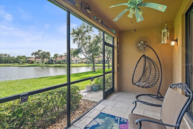 7325 Skybird Rd Unit 399, Bradenton, FL 34209 - unfurnished sunroom featuring a water view and a ceiling fan