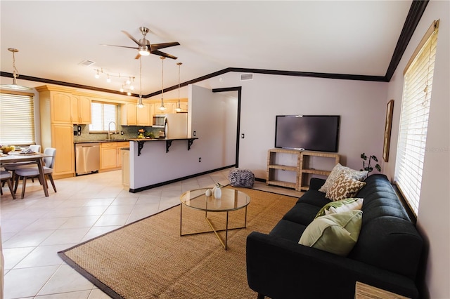4945 Camphor Ave, Sarasota, FL 34231 - living area featuring ornamental molding, light tile patterned floors, ceiling fan, and vaulted ceiling