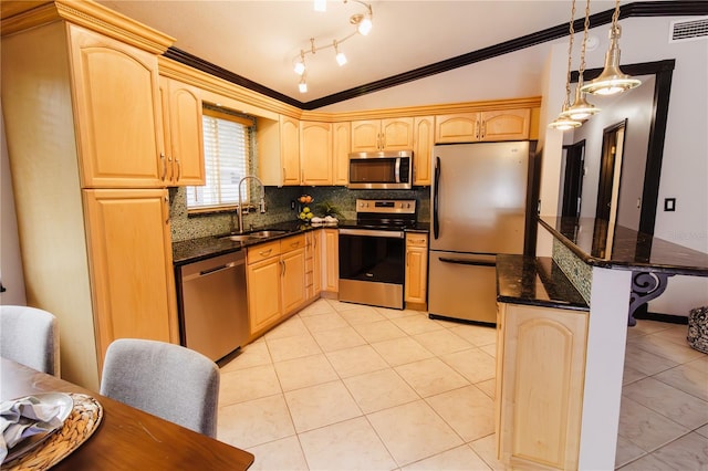 4945 Camphor Ave, Sarasota, FL 34231 - kitchen with stainless steel appliances, light tile patterned floors, backsplash, vaulted ceiling, and light brown cabinets