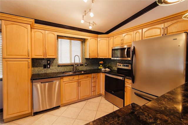 4945 Camphor Ave, Sarasota, FL 34231 - kitchen featuring appliances with stainless steel finishes, lofted ceiling, tasteful backsplash, crown molding, and light tile patterned floors