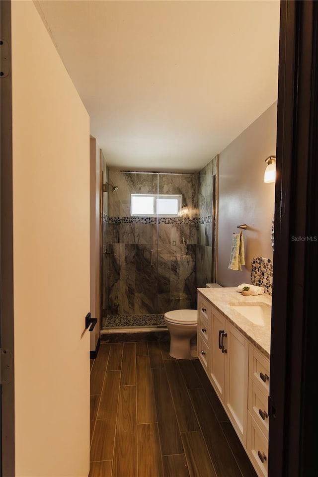 4945 Camphor Ave, Sarasota, FL 34231 - bathroom with vanity, a shower stall, and wood tiled floors