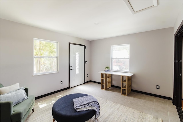 4945 Camphor Ave, Sarasota, FL 34231 - entryway with light tile patterned floors and baseboards