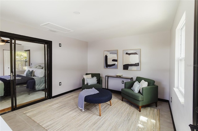4945 Camphor Ave, Sarasota, FL 34231 - sitting room with attic access and light tile patterned floors