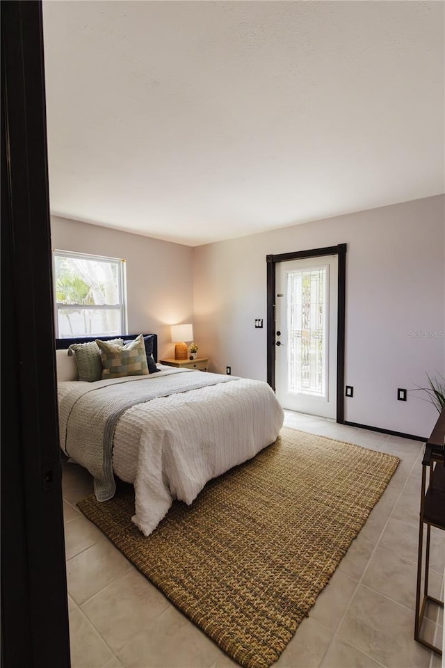 4945 Camphor Ave, Sarasota, FL 34231 - bedroom with light tile patterned floors