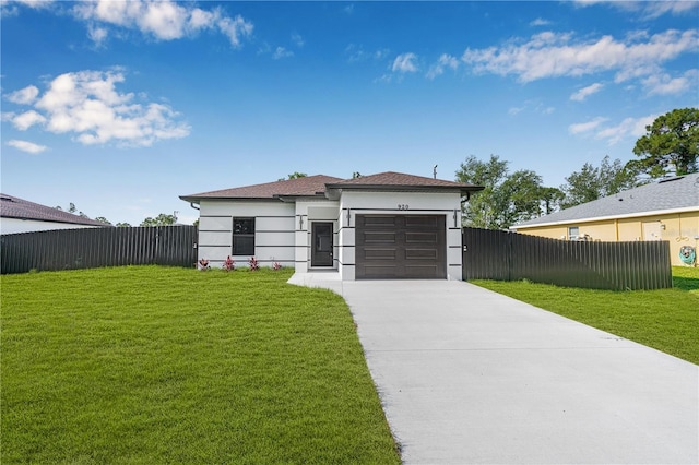 920 Barton St E, Lehigh Acres, FL 33974 - view of front of property featuring driveway, an attached garage, and stucco siding