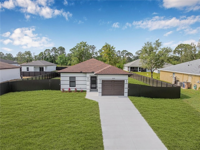 920 Barton St E, Lehigh Acres, FL 33974 - view of front of house with concrete driveway, an attached garage, and a residential view