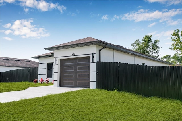 920 Barton St E, Lehigh Acres, FL 33974 - garage featuring concrete driveway