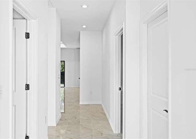 920 Barton St E, Lehigh Acres, FL 33974 - hall featuring light marble finish floors, baseboards, and recessed lighting