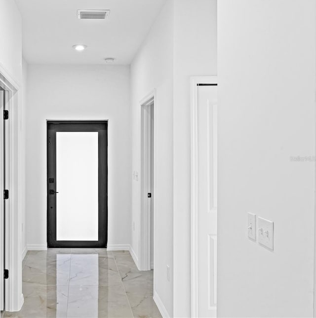 920 Barton St E, Lehigh Acres, FL 33974 - corridor featuring light marble finish flooring and baseboards