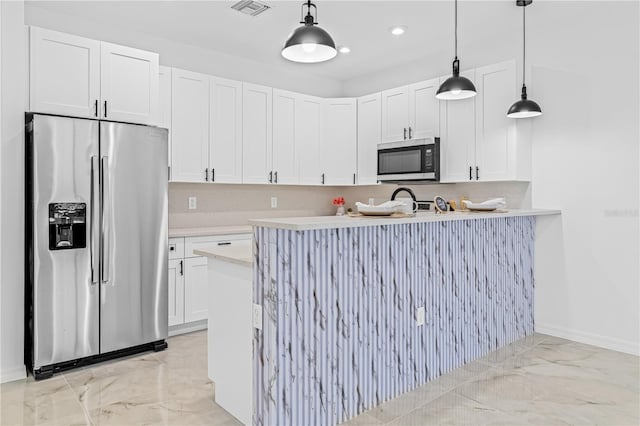 920 Barton St E, Lehigh Acres, FL 33974 - kitchen featuring appliances with stainless steel finishes, light marble finish floors, light countertops, white cabinetry, and baseboards