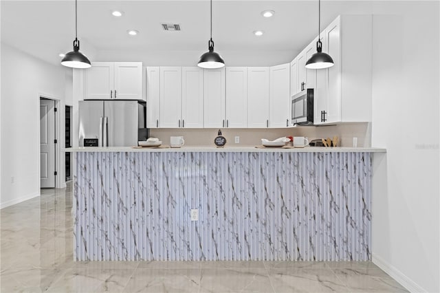 920 Barton St E, Lehigh Acres, FL 33974 - kitchen featuring light marble finish floors, stainless steel appliances, baseboards, recessed lighting, and white cabinetry