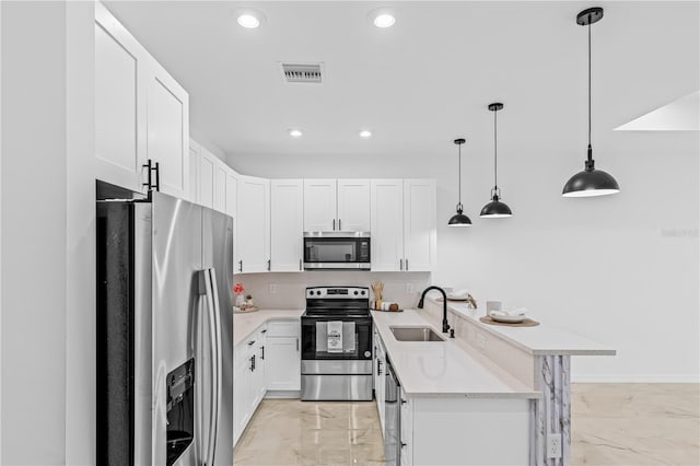 920 Barton St E, Lehigh Acres, FL 33974 - kitchen with appliances with stainless steel finishes, a sink, light marble finish flooring, light countertops, and recessed lighting