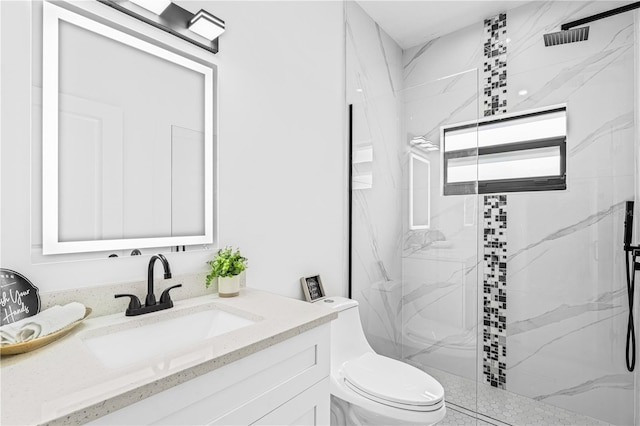 920 Barton St E, Lehigh Acres, FL 33974 - full bath with a marble finish shower, vanity, and toilet