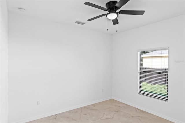 920 Barton St E, Lehigh Acres, FL 33974 - empty room with light marble finish flooring, baseboards, a ceiling fan, and a smoke detector