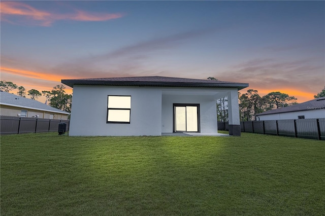 920 Barton St E, Lehigh Acres, FL 33974 - rear view of property featuring stucco siding