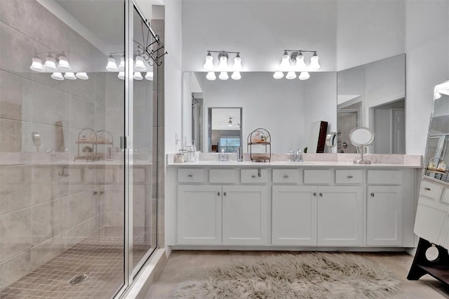 5695 Palmer Cir Unit 203, Bradenton, FL 34211 - bathroom featuring a stall shower and double vanity