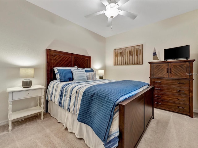 5695 Palmer Cir Unit 203, Bradenton, FL 34211 - bedroom featuring light carpet and a ceiling fan
