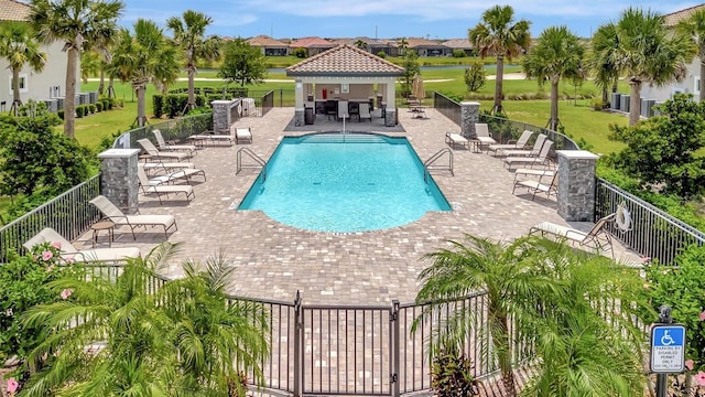 5695 Palmer Cir Unit 203, Bradenton, FL 34211 - community pool featuring a gazebo, a patio, and a residential view