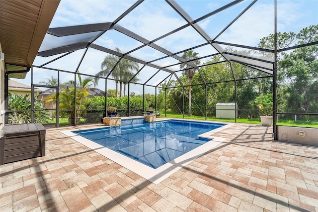 1711 145th St E, Sarasota, FL 34212 - outdoor pool featuring a patio area, a storage unit, and glass enclosure
