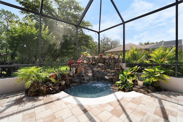 1711 145th St E, Sarasota, FL 34212 - view of patio / terrace featuring glass enclosure