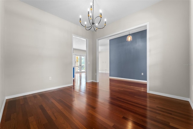 1711 145th St E, Sarasota, FL 34212 - unfurnished room with a chandelier and wood finished floors