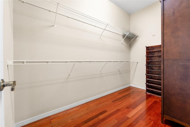 1711 145th St E, Sarasota, FL 34212 - walk in closet with wood finished floors