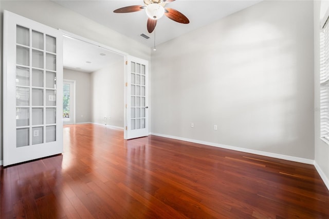 1711 145th St E, Sarasota, FL 34212 - empty room with french doors, ceiling fan, wood finished floors, and lofted ceiling