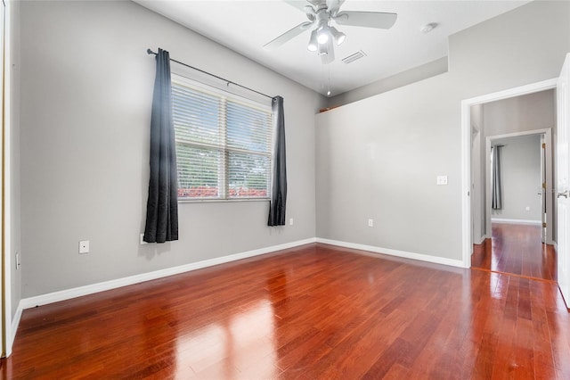1711 145th St E, Sarasota, FL 34212 - spare room with ceiling fan, wood finished floors, and a smoke detector