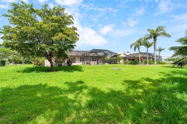 1711 145th St E, Sarasota, FL 34212 - view of green lawn with glass enclosure