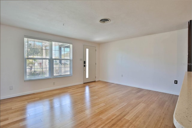 7355 Cass Cir, Sarasota, FL 34231 - entrance foyer with healthy amount of natural light and light wood-style flooring