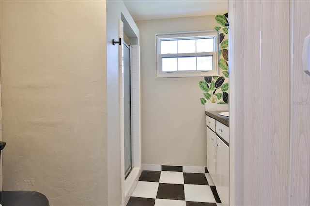 7355 Cass Cir, Sarasota, FL 34231 - full bath with tile patterned floors, an enclosed shower, and vanity