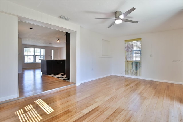 7355 Cass Cir, Sarasota, FL 34231 - empty room with light wood finished floors and a ceiling fan
