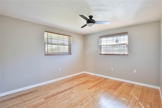 7355 Cass Cir, Sarasota, FL 34231 - unfurnished room featuring wood finished floors and a ceiling fan