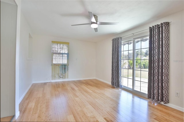 7355 Cass Cir, Sarasota, FL 34231 - spare room with light wood-style floors, healthy amount of natural light, and a ceiling fan