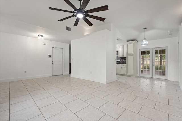 5433 81st Avenue Cir E, Palmetto, FL 34221 - unfurnished living room with ceiling fan, light tile patterned flooring, french doors, lofted ceiling, and baseboards