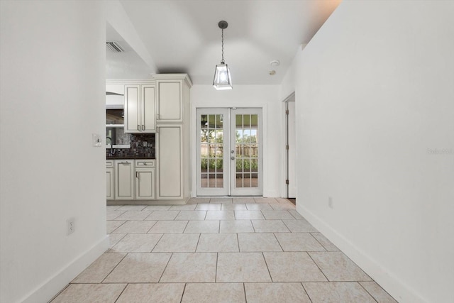 5433 81st Avenue Cir E, Palmetto, FL 34221 - entryway with french doors, light tile patterned floors, and baseboards