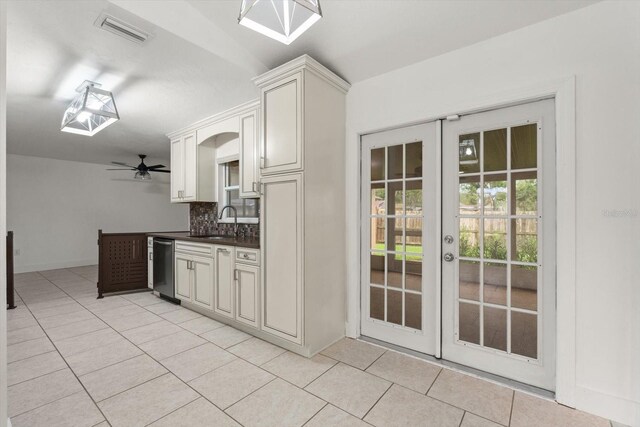 5433 81st Avenue Cir E, Palmetto, FL 34221 - kitchen featuring a sink, light tile patterned floors, dishwasher, and tasteful backsplash