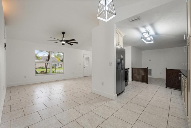 5433 81st Avenue Cir E, Palmetto, FL 34221 - kitchen with stainless steel fridge with ice dispenser, light tile patterned flooring, ceiling fan, and baseboards