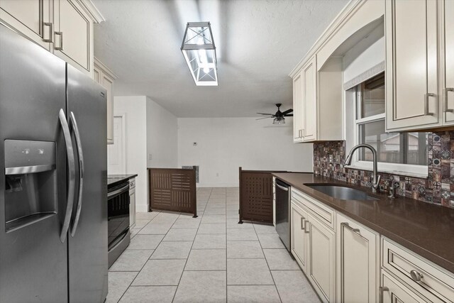 5433 81st Avenue Cir E, Palmetto, FL 34221 - kitchen with stainless steel appliances, a sink, a ceiling fan, and dark countertops