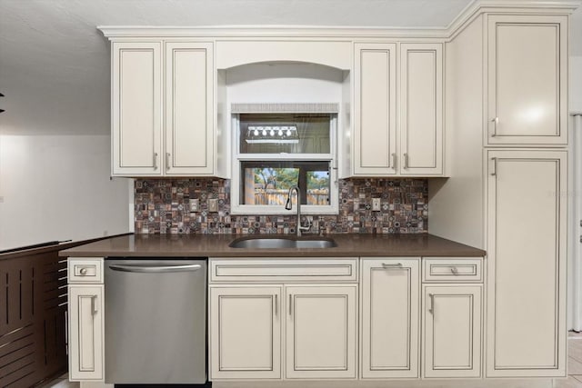 5433 81st Avenue Cir E, Palmetto, FL 34221 - kitchen with stainless steel dishwasher, a sink, dark countertops, and cream cabinets