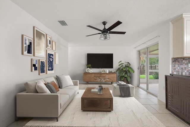 5433 81st Avenue Cir E, Palmetto, FL 34221 - living room featuring a ceiling fan and light tile patterned flooring