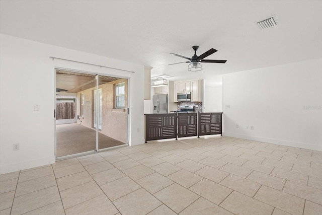 5433 81st Avenue Cir E, Palmetto, FL 34221 - unfurnished living room featuring a ceiling fan, light tile patterned floors, and baseboards