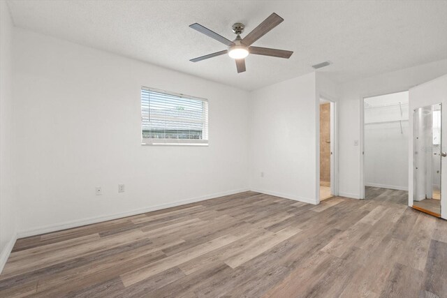 5433 81st Avenue Cir E, Palmetto, FL 34221 - spare room featuring light wood-style floors, a ceiling fan, and baseboards