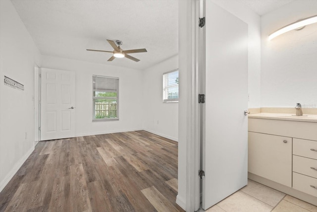 5433 81st Avenue Cir E, Palmetto, FL 34221 - interior space with ceiling fan, wood finished floors, vanity, and baseboards