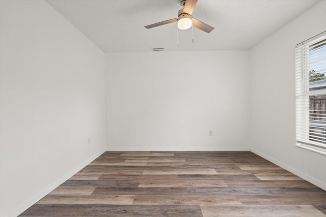 5433 81st Avenue Cir E, Palmetto, FL 34221 - unfurnished room with a ceiling fan, wood finished floors, and baseboards
