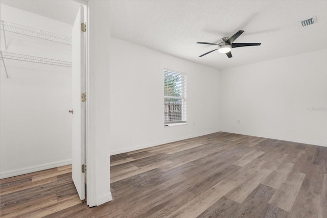 5433 81st Avenue Cir E, Palmetto, FL 34221 - unfurnished bedroom featuring wood finished floors, a ceiling fan, and baseboards