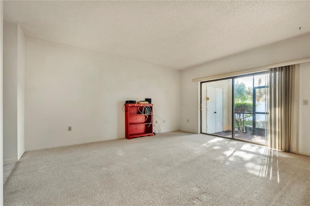 2727 75th St W Unit 1Af, Bradenton, FL 34209 - spare room featuring carpet floors and a textured ceiling